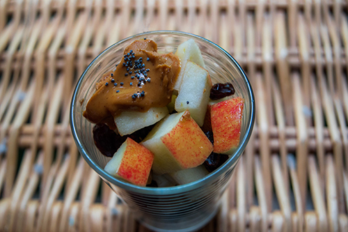 Apple with peanut butter, raisins, & chia seeds ( Vegan)